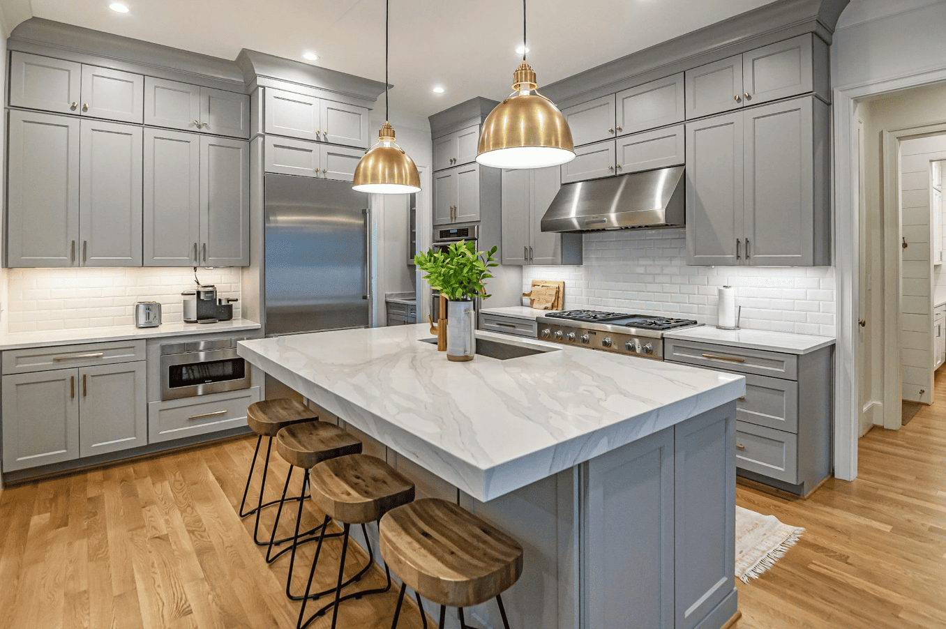 Modern executive home in Drake Landing, Okotoks featuring stone accents and large windows.